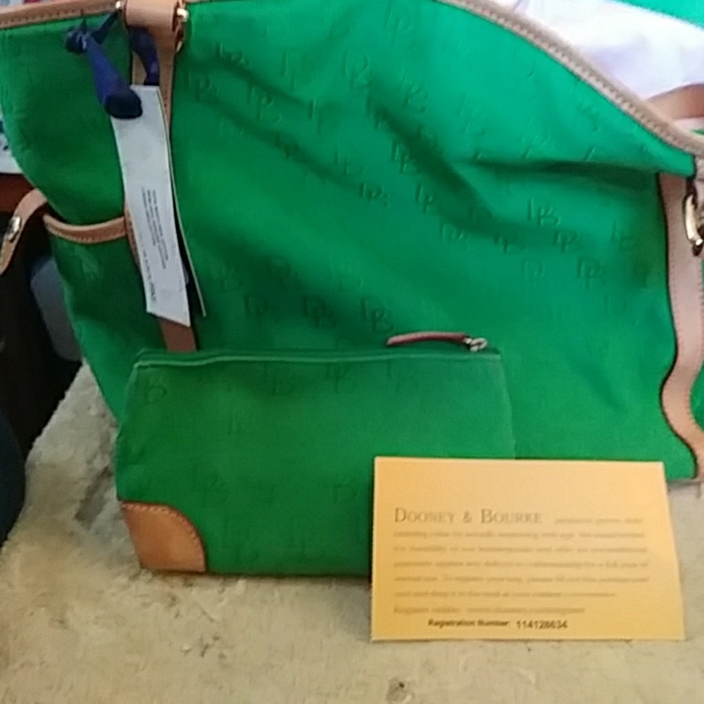 Genuine Dooney Bourke purse with make up bag.